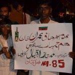 PTI Supporter hold banner again irregularities in Election 2013
