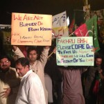 PTI Supporter hold banner again irregularities in Election 2013